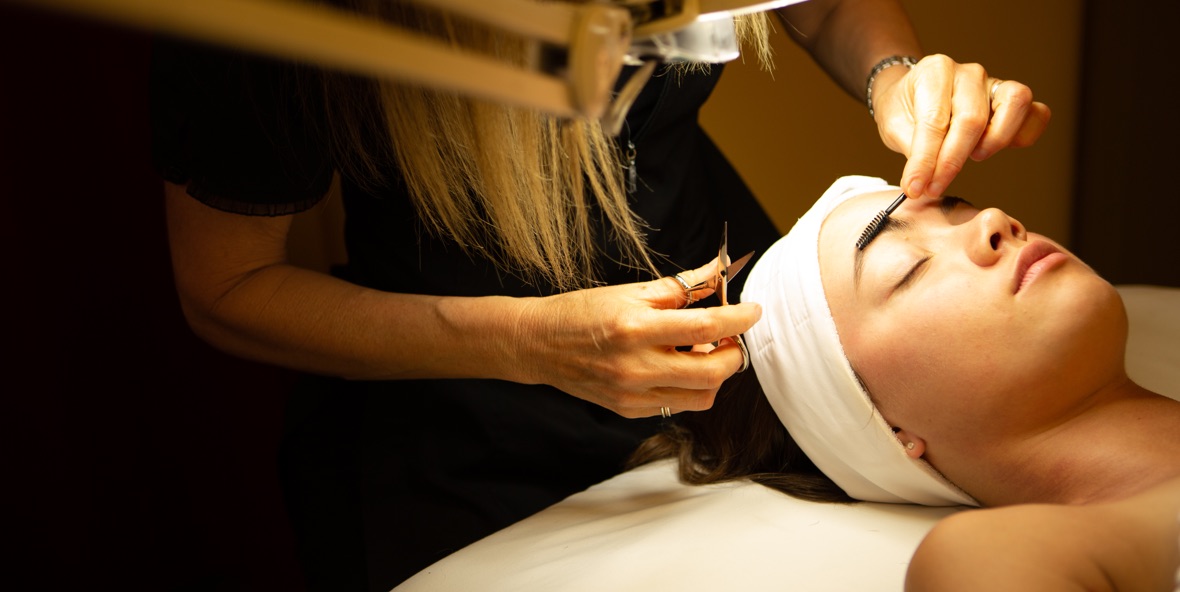 Receiving skin care facial at Mane Attraction