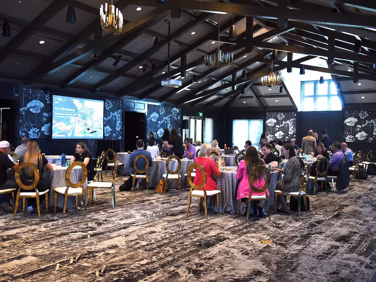 red berry lakeside ballroom with people sitting at tables