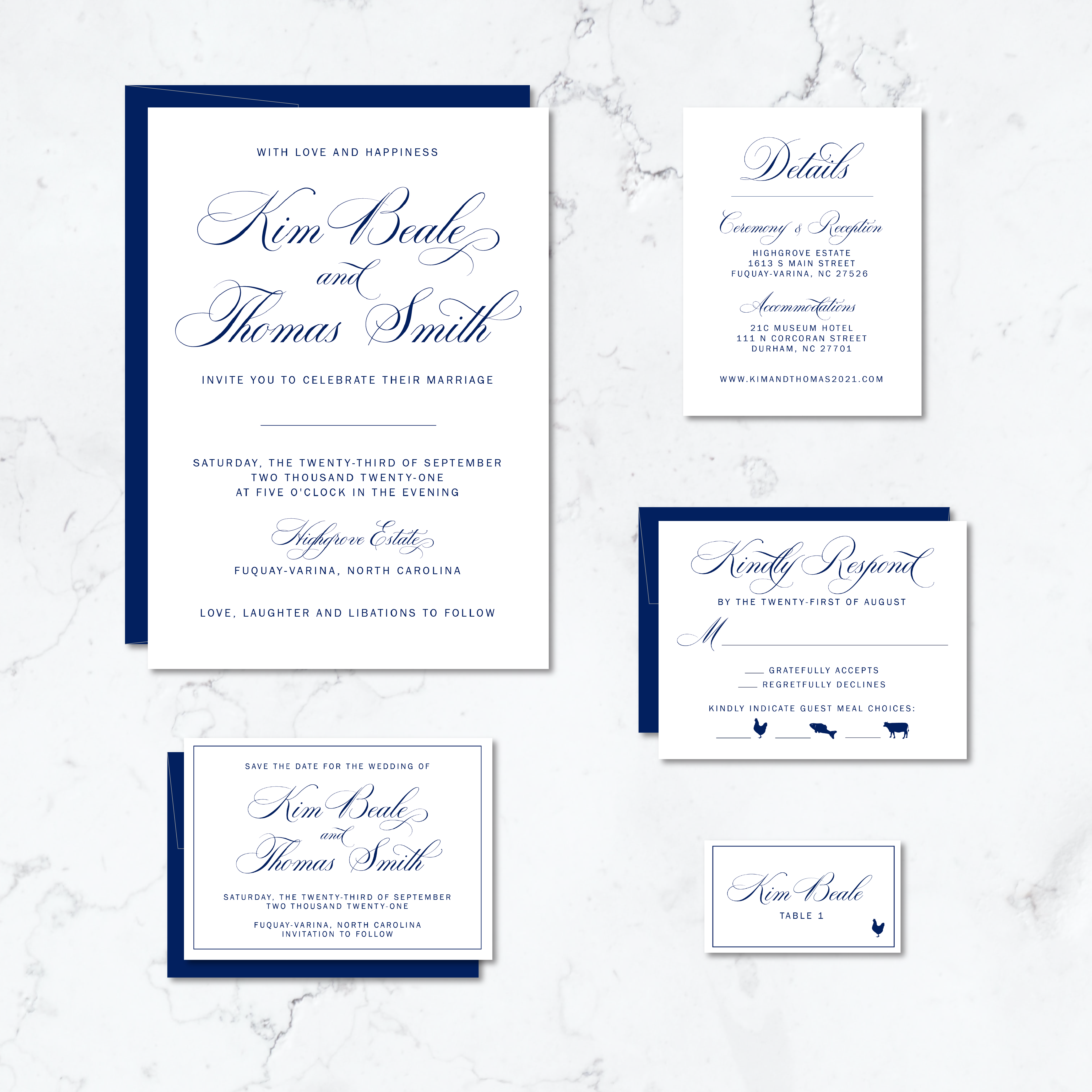 A wedding invitation suite with white paper and cursive lettering in navy ink.