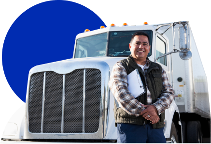 Driver standing next to truck