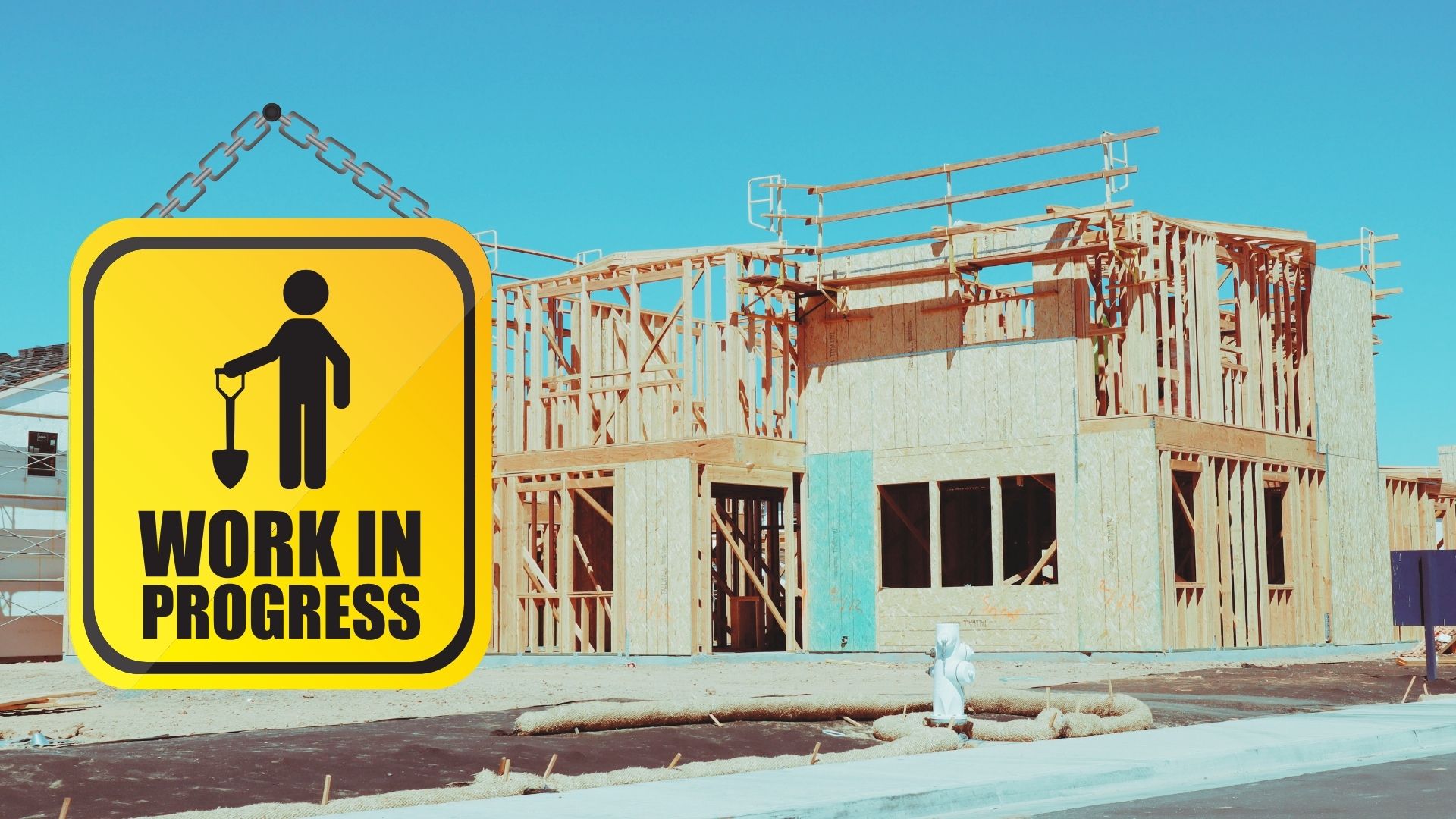 a house under construction with a sign that says work in progress