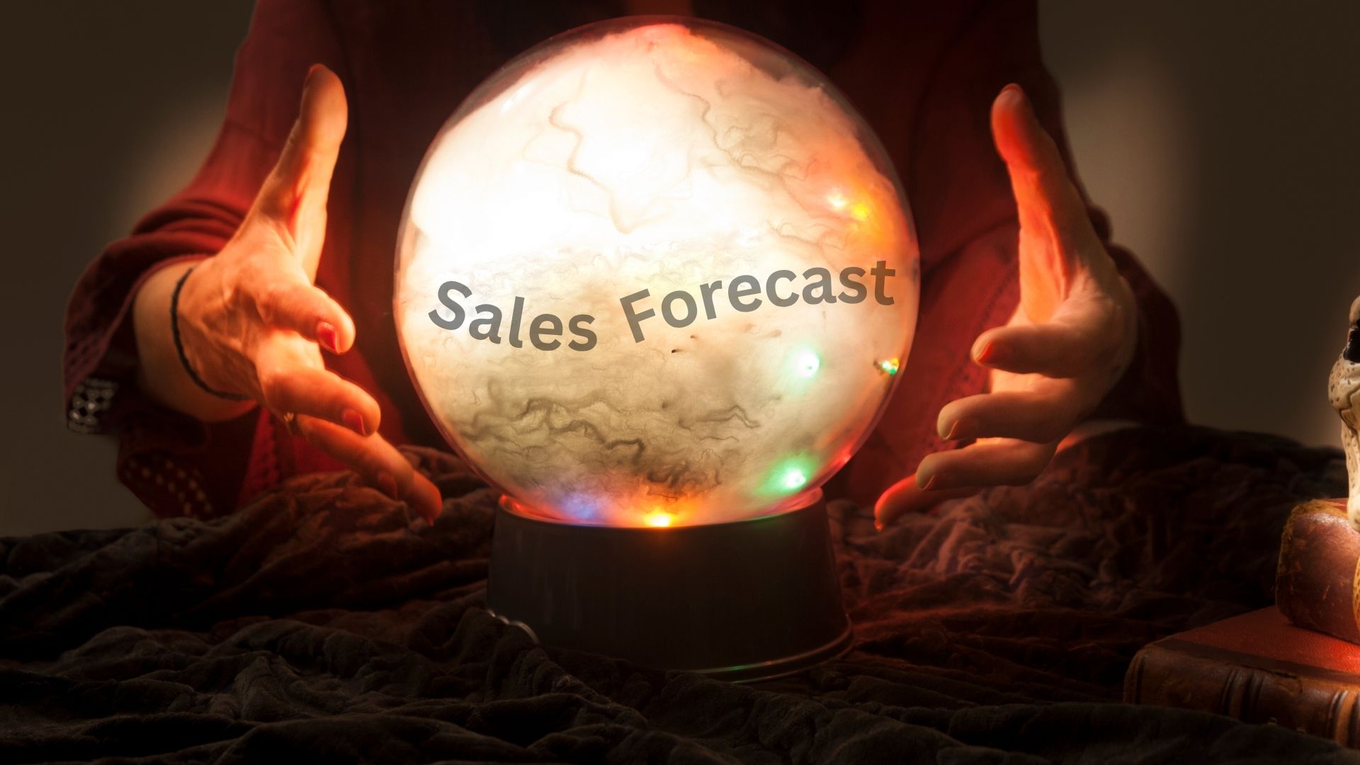 crystal ball with sales forecast inside