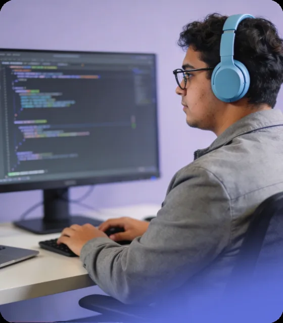 Developer reviewing code at a monitor