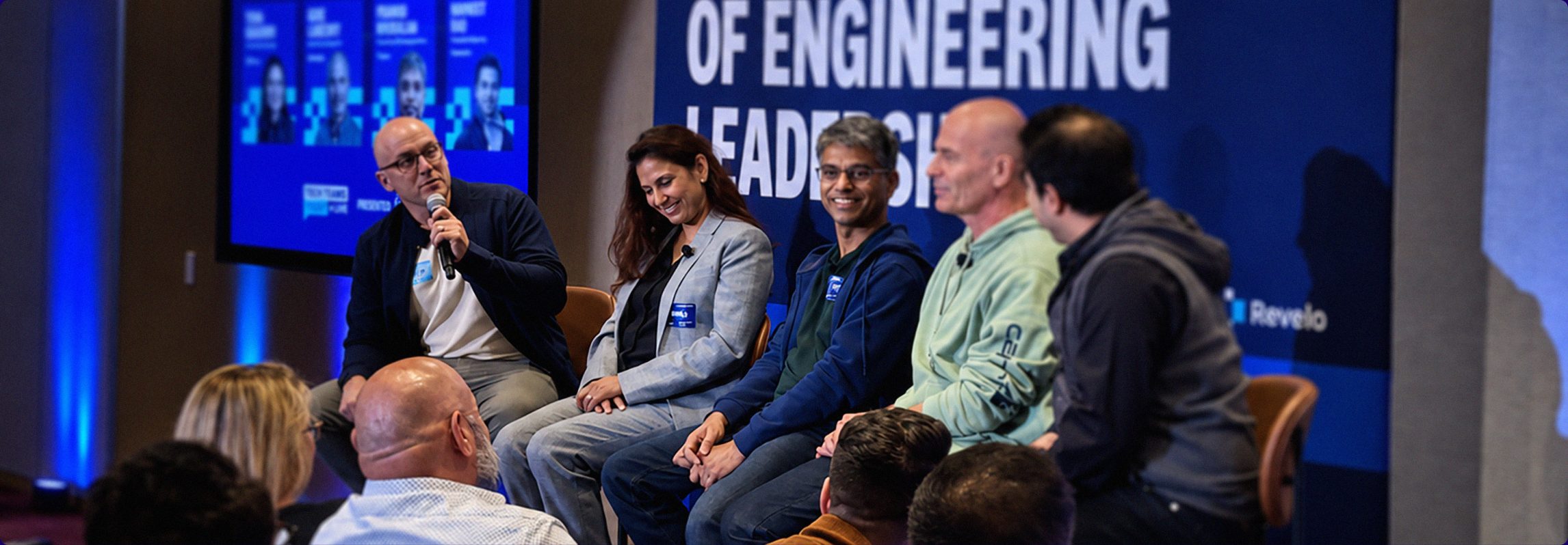 Panel of engineering leaders on stage at a T3 Live event