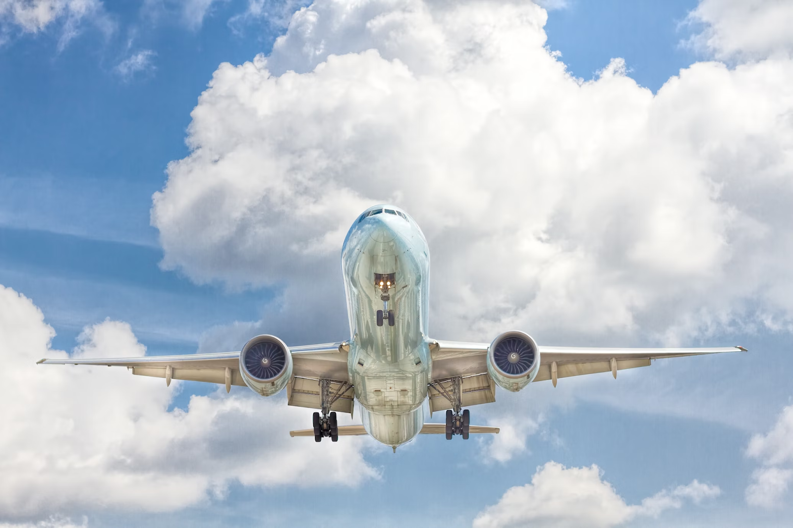 gray-and-white-airplane-on-flight-near-clear-blue-sky