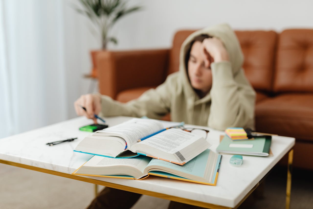 American student buckling down to study for the intense final exams season at a UK university