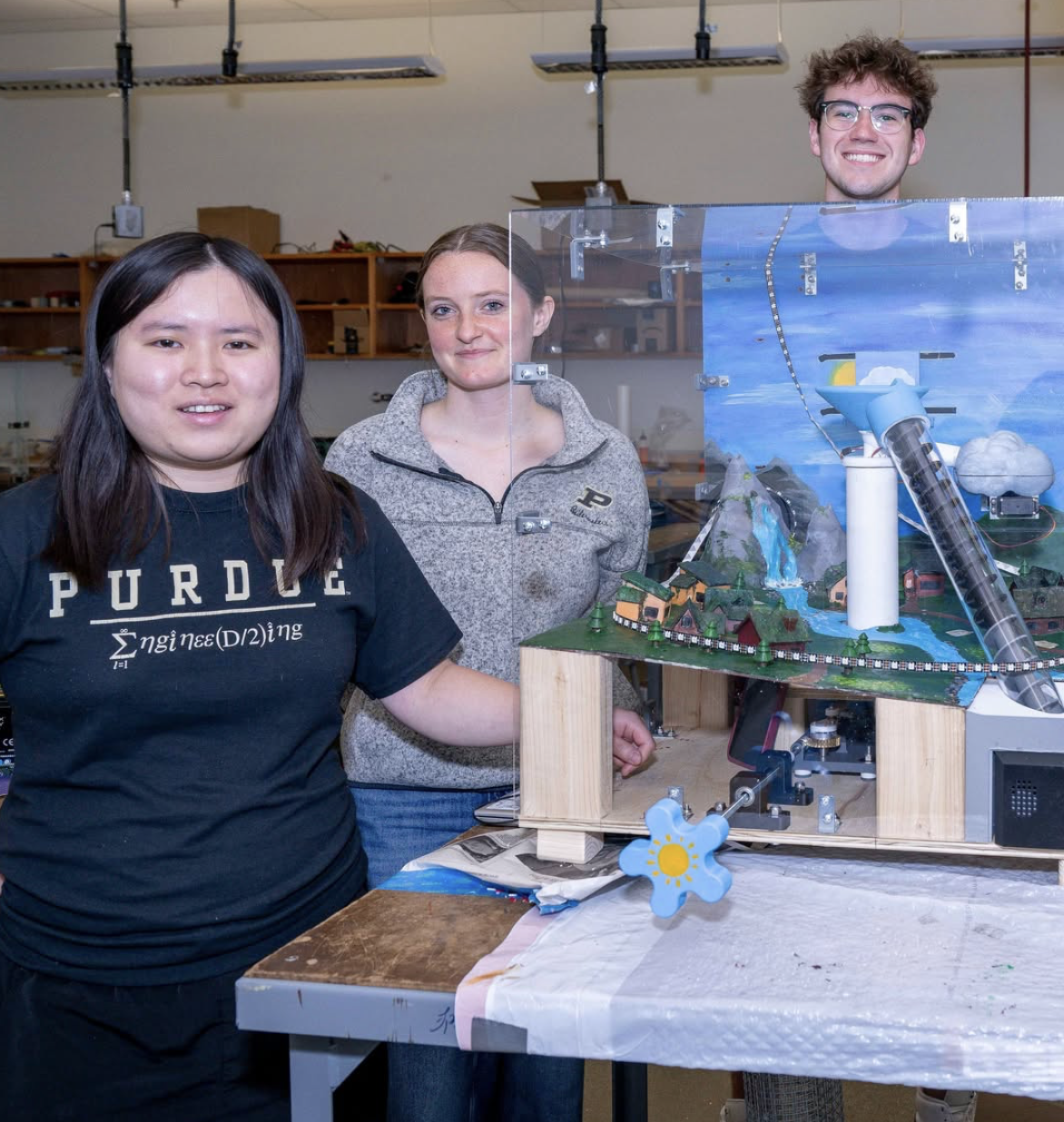 Purdue engineering student Sylvia Chen and her design team pose with their interactive water cycle display
