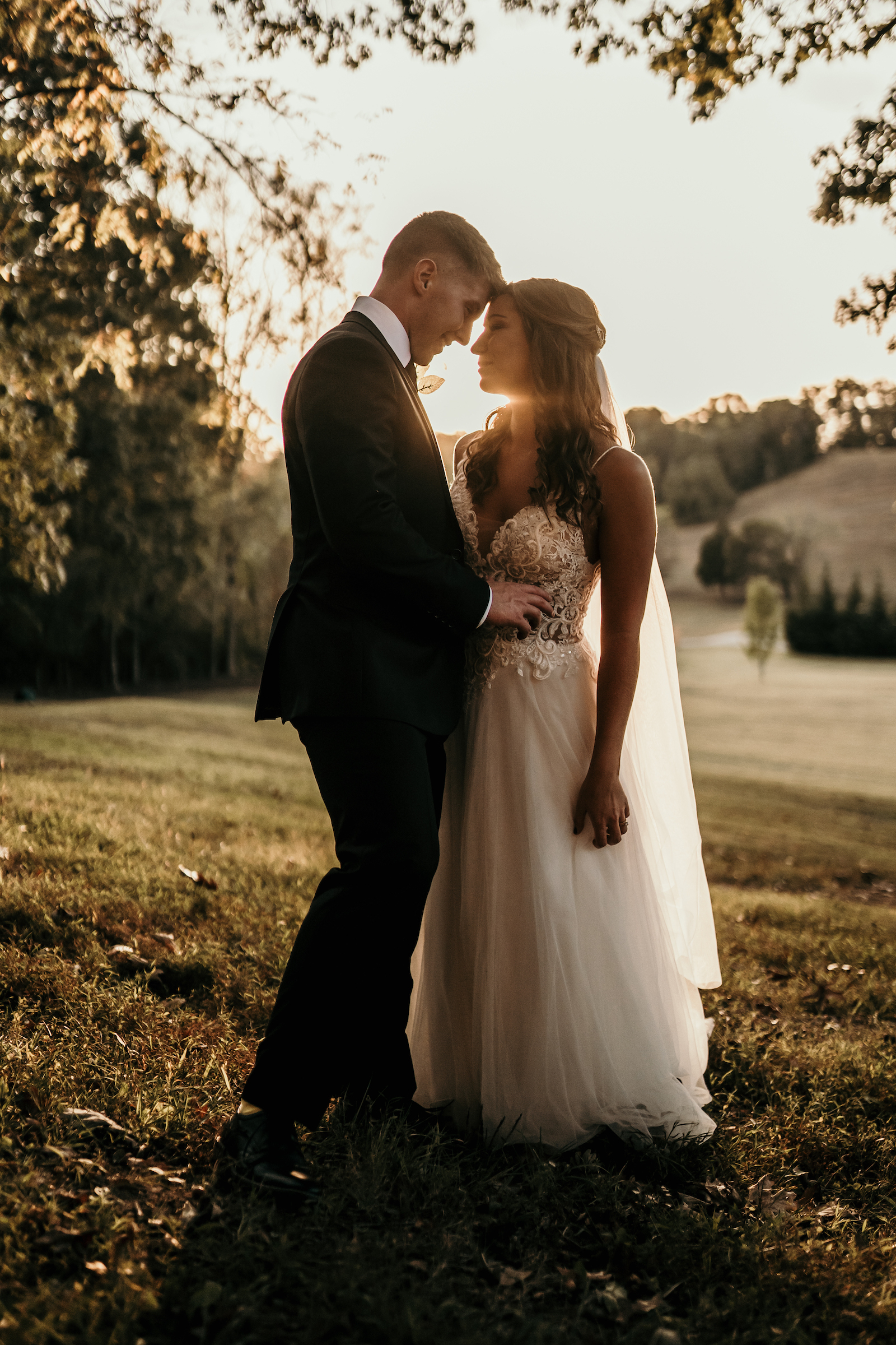 a bride and groom standing together. 
