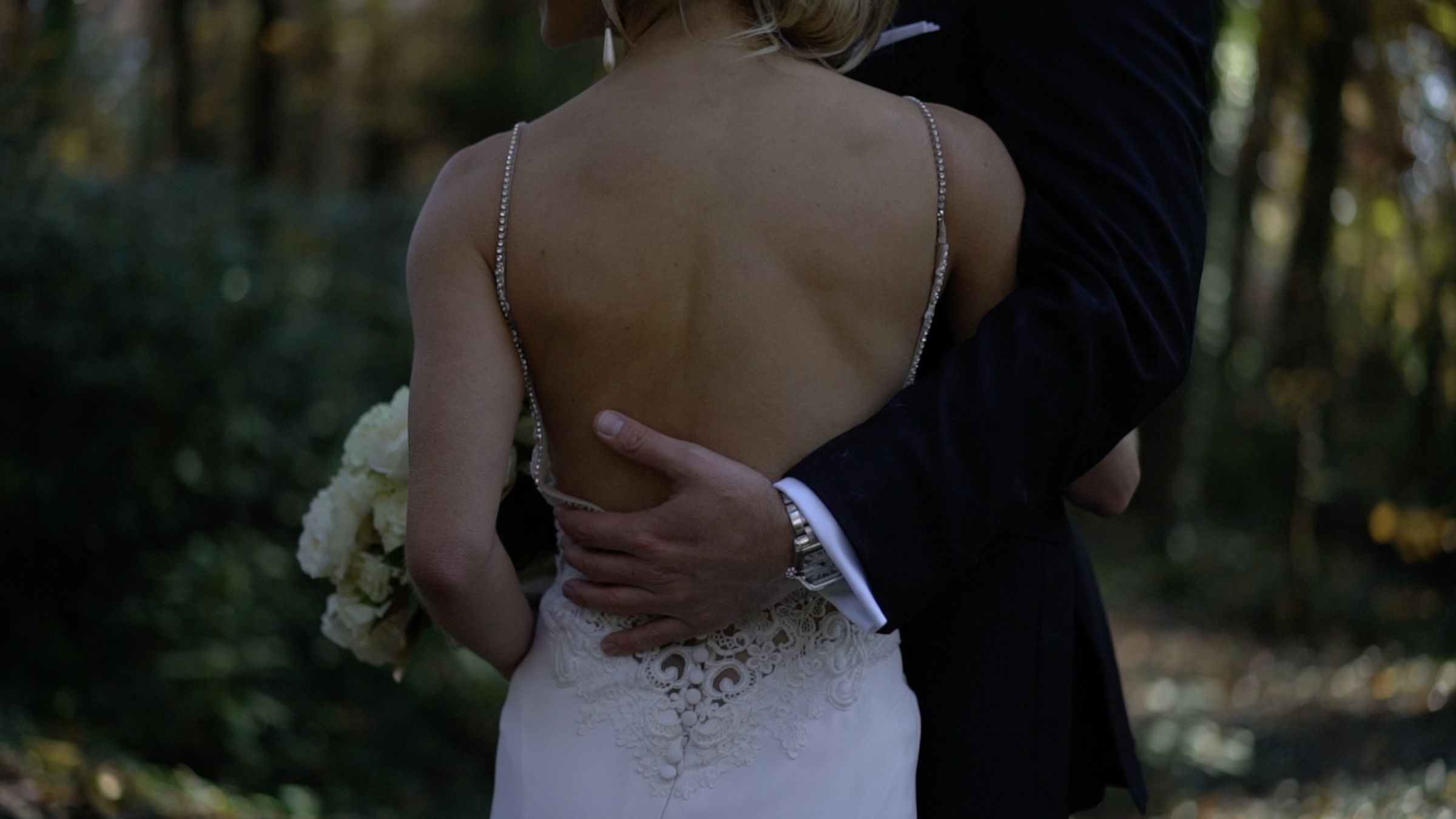 A bride and groom walking together.