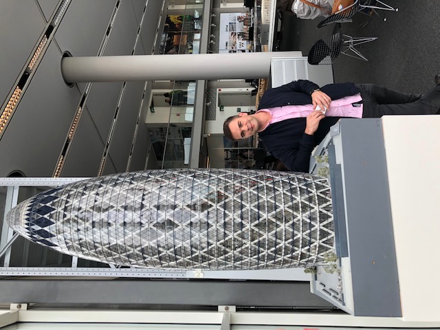 Picture of Thomas Zub at Foster & Partners HQ next to the Guirking Building model