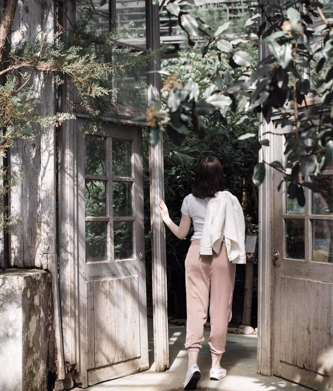 A woman in pink pants and a white shirt.