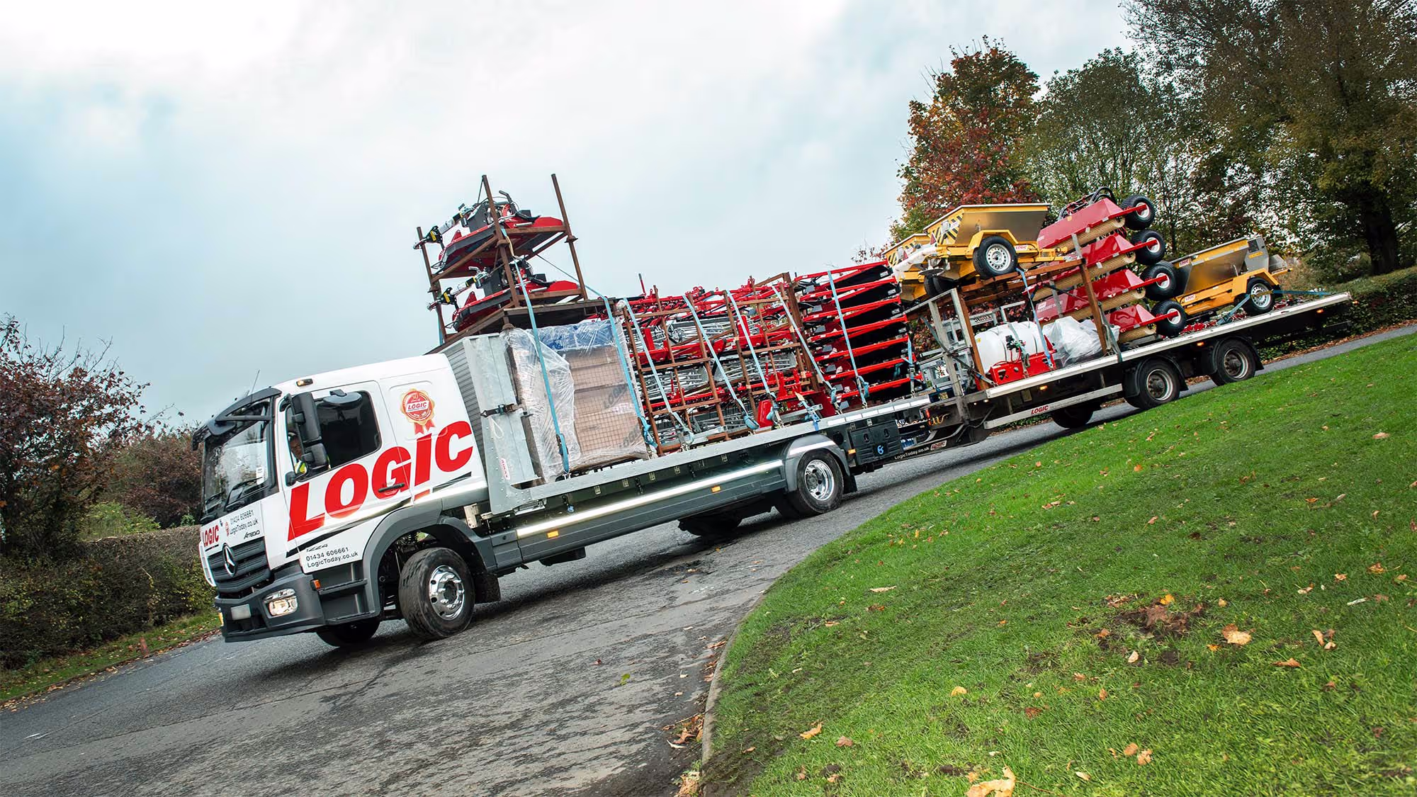 Fully loaded Logic lorry and flatbed trailer
