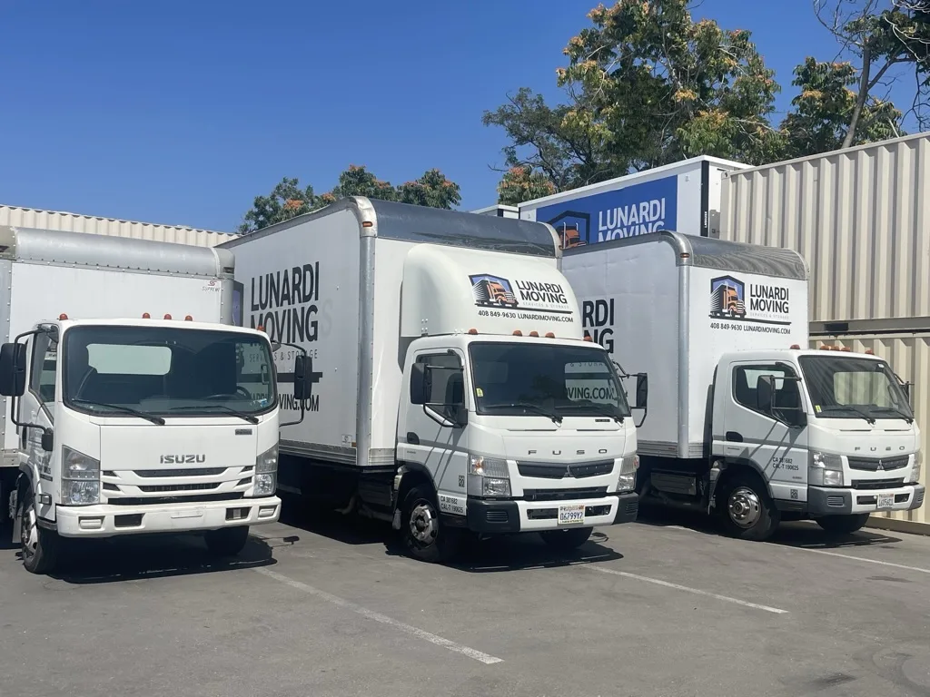 Lunardi Moving branded truck fleet showing CA PUC 190625 and DMV MCP 381682 on the doors