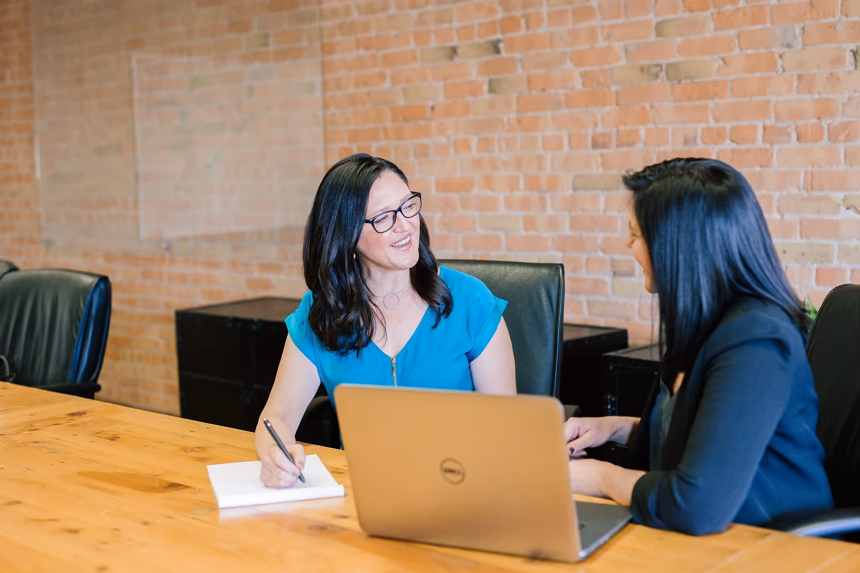 two women talking in an office