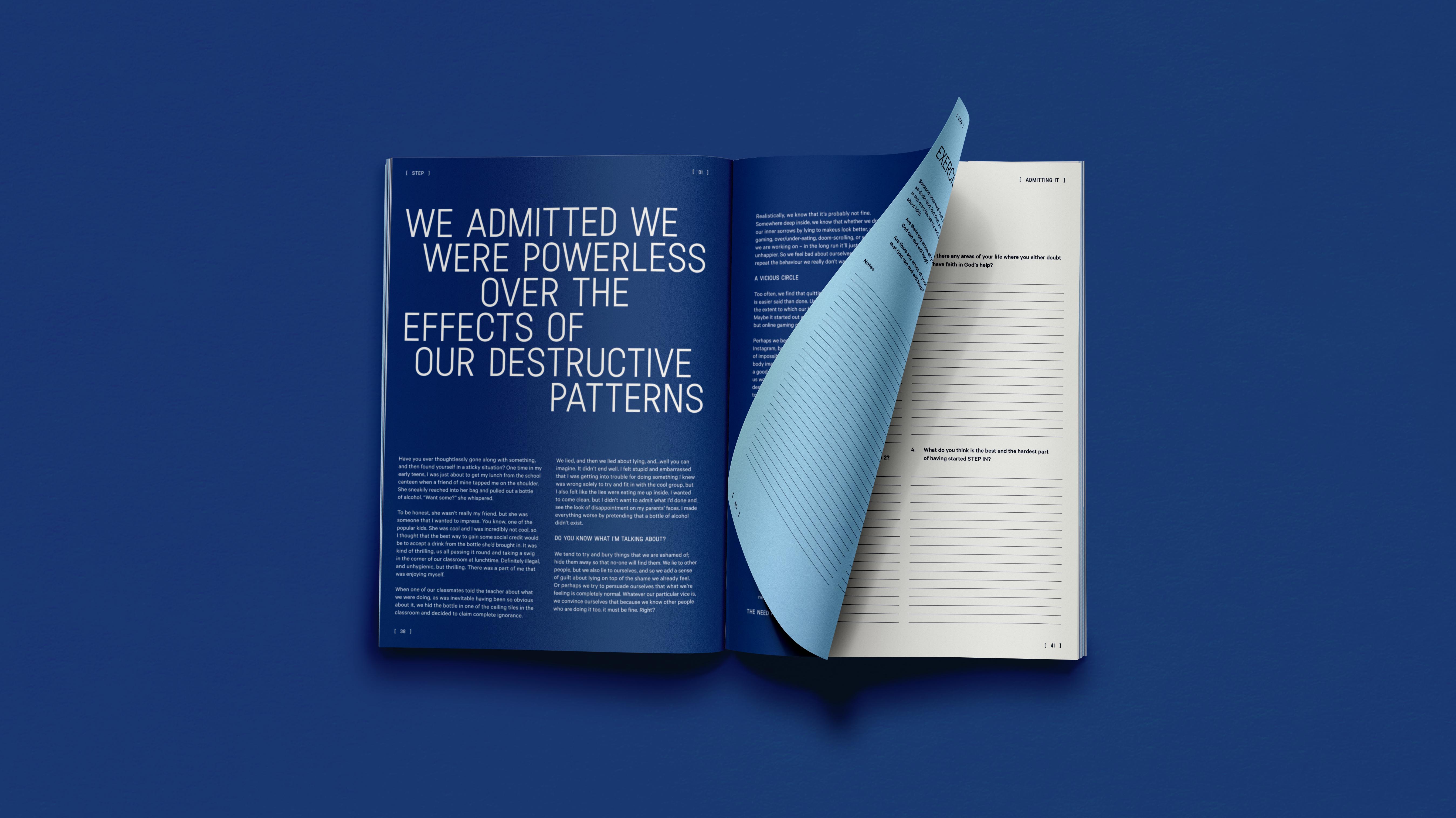 Open book with pages displaying reflective text on destructive patterns and a partially turned light blue page with lined exercise prompts.