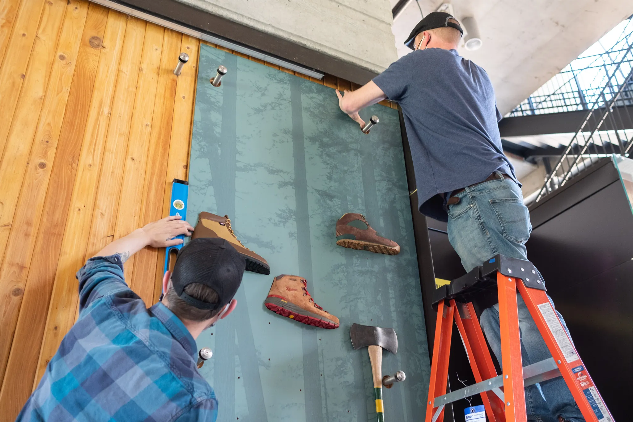 infinity Images team working on the Portland Timbers Danner collab wall