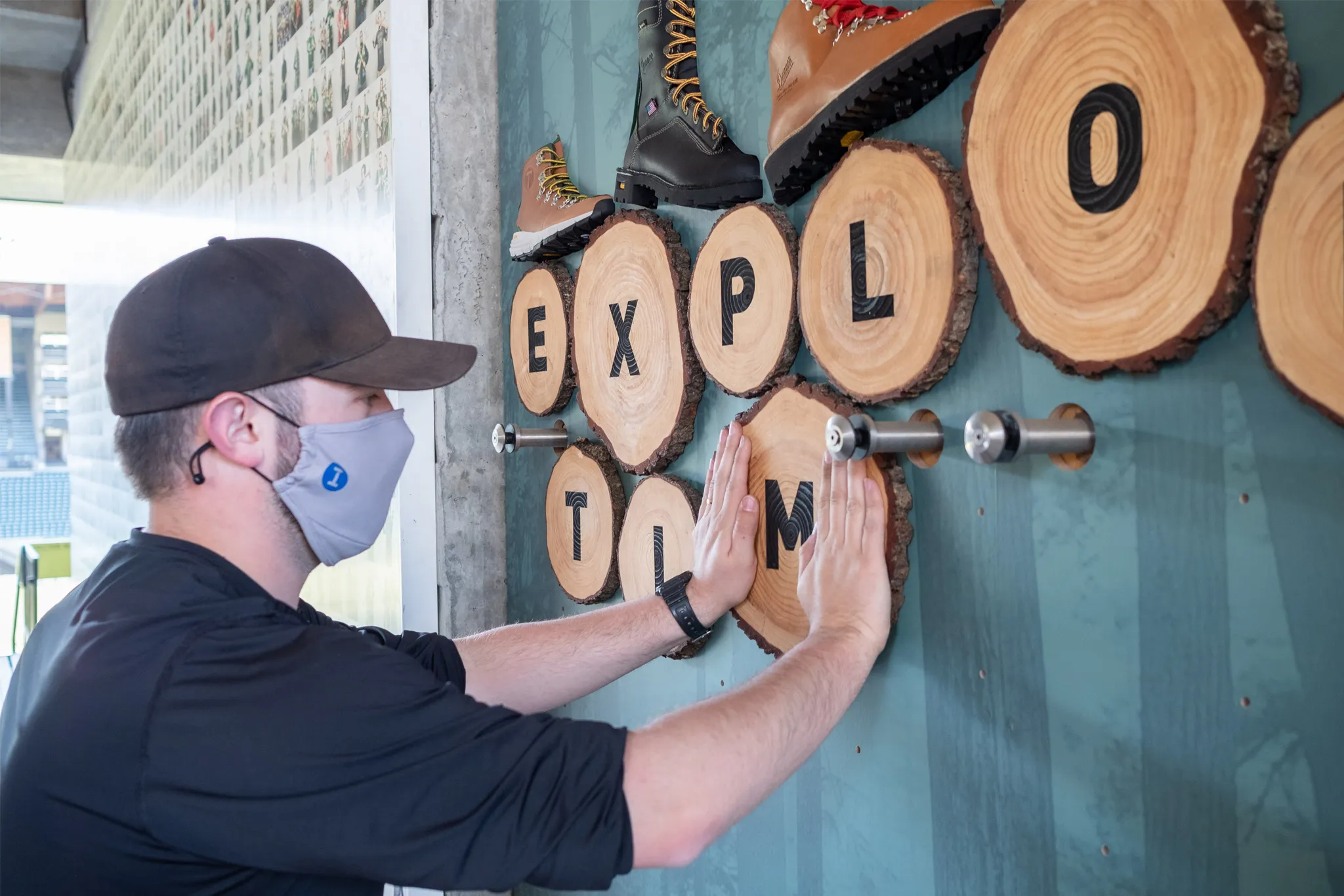 Infinity Images employee constructing the Portland Timbers Danner display wall