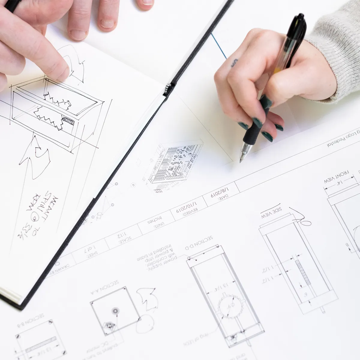 Infinity Images team drawing up installations