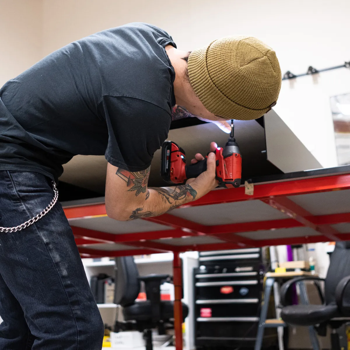 Infinity Images employee installing a graphics display