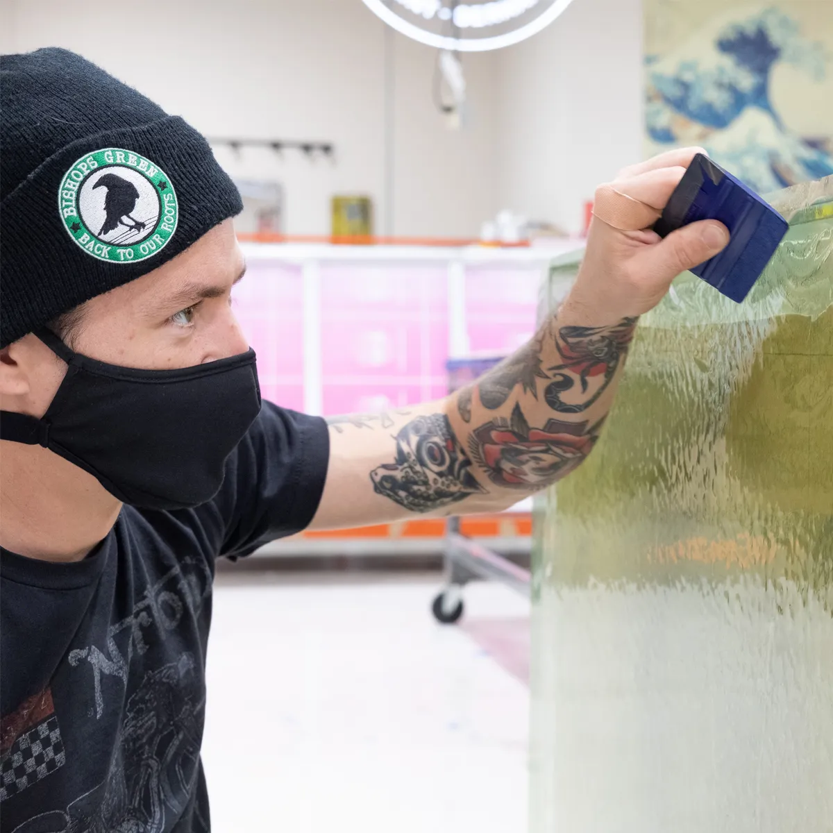Infinity Images employee putting the finishing touches on an installation project