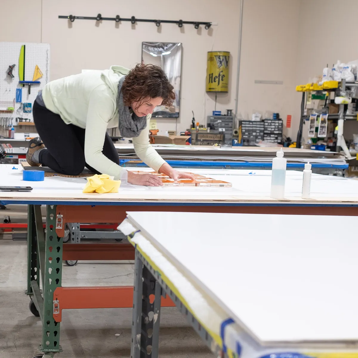 Infinity Images employee putting the finishing touches on an installation project