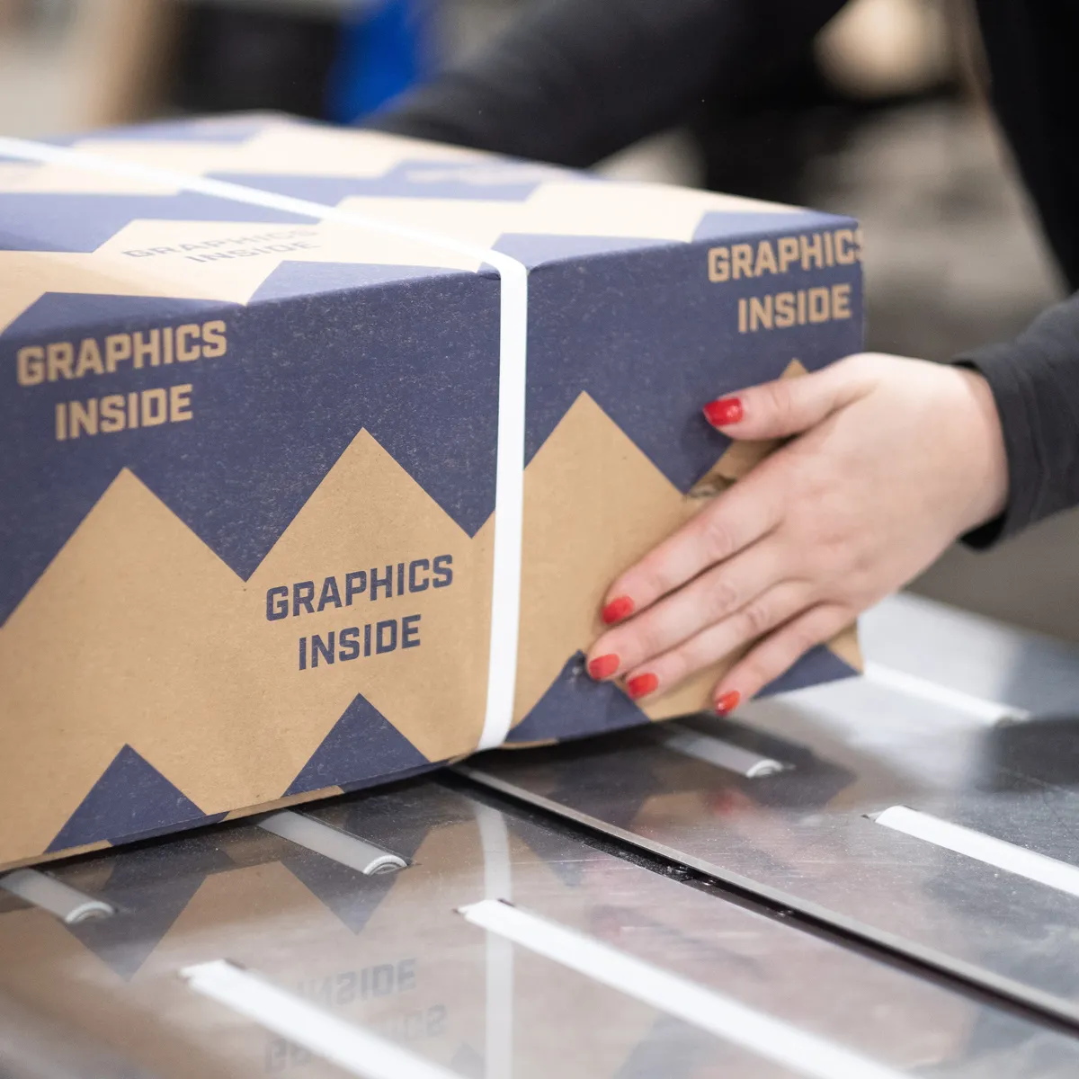 Infinity Images employee boxing goods