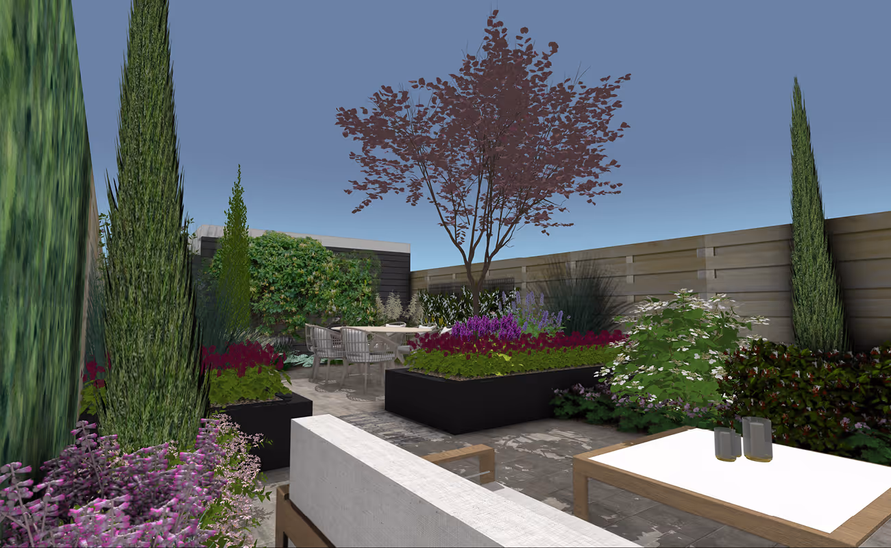 Modern backyard garden with tall greenery, raised flower beds, a small tree, patio furniture, and a wooden fence under a clear sky.