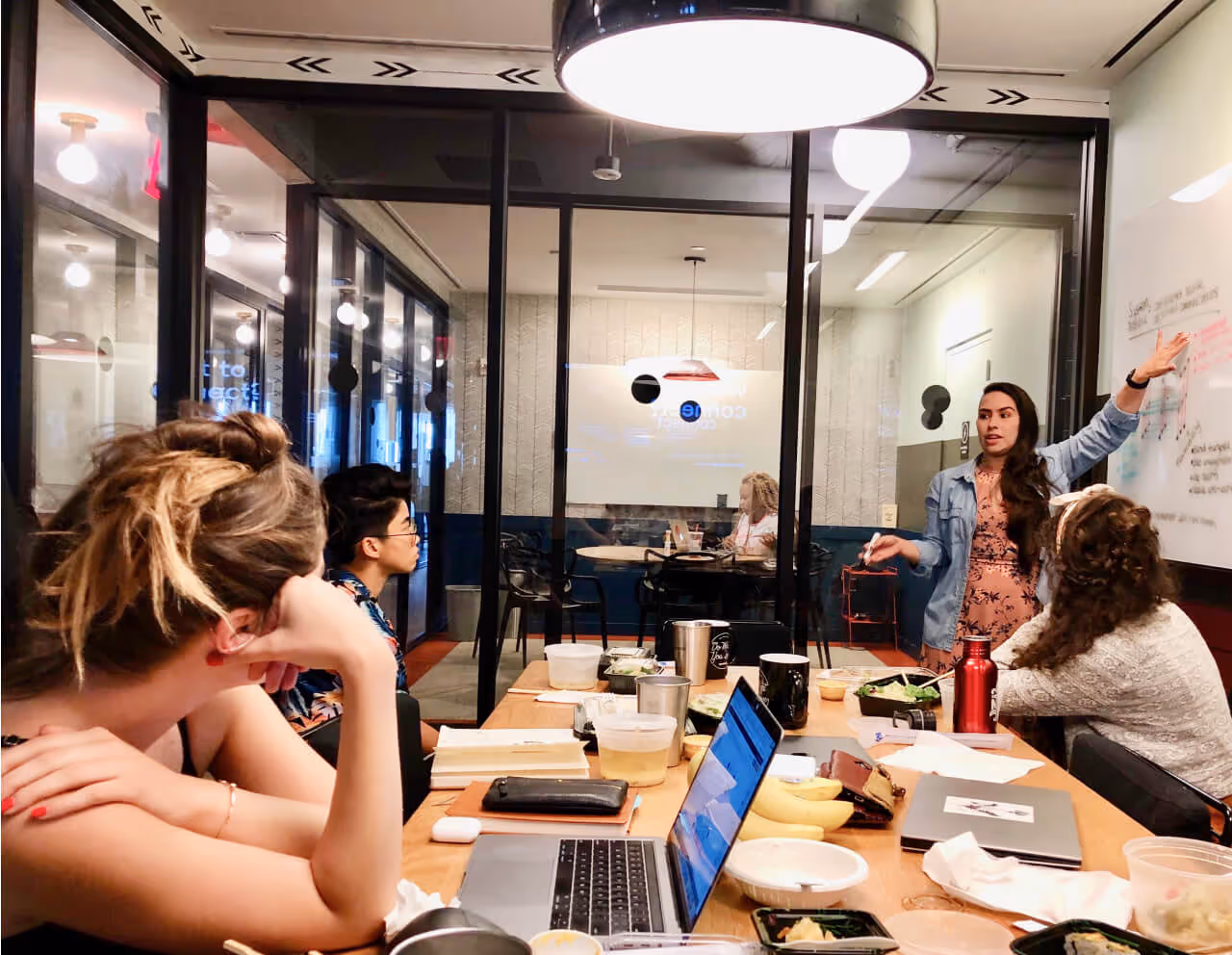 Team meeting in a glass-walled office
