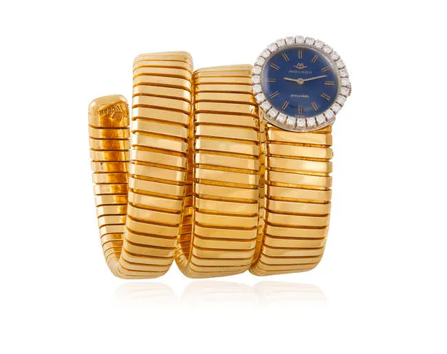 A LADY'S GOLD AND DIAMOND 'TUBOGAS' BRACELET WATCH, BY BULGARI & MOVADO, CIRCA 1965