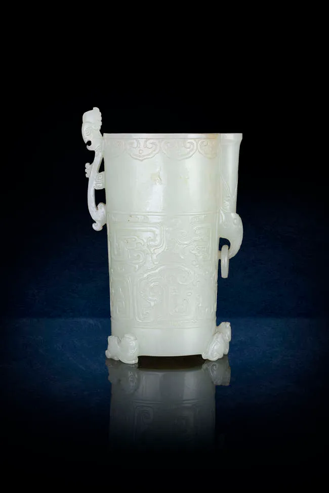 A RARE PALE GREENISH-WHITE JADE ARCHAISTIC FOOTED CUP