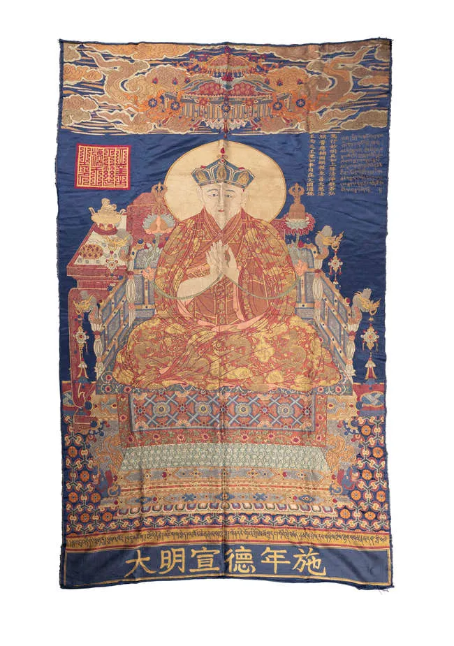 A SILK BROCADE THANGKA OF THE PORTRAIT OF THE MONASTIC PATRONAGE SHAKYA YESHE