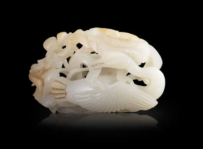 A RETICULATED WHITE JADE 'EGRETS AND LOTUS' GROUP