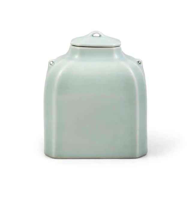 A RARE CELADON-GLAZED FACETED JAR AND COVER