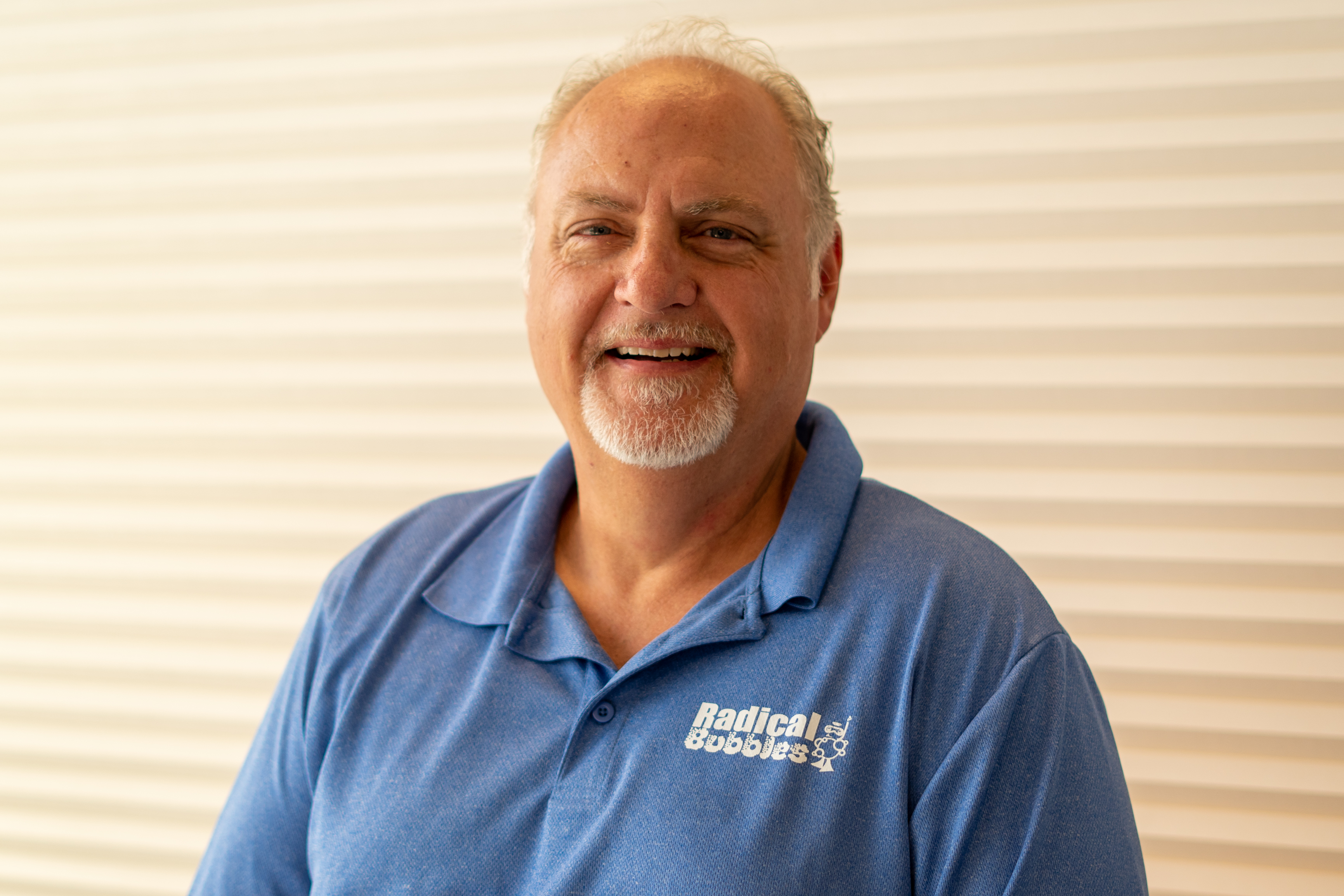 headshot of owner mike smiling