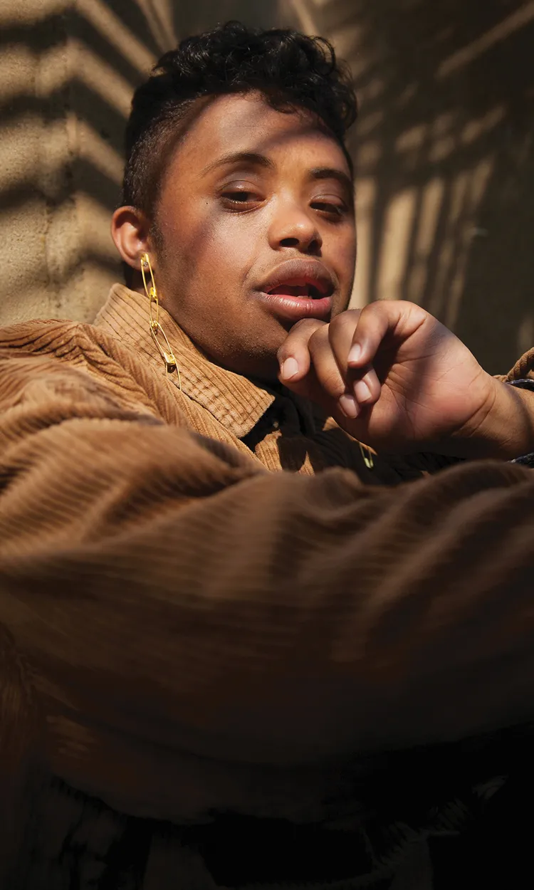 A man with his hand on his chin.