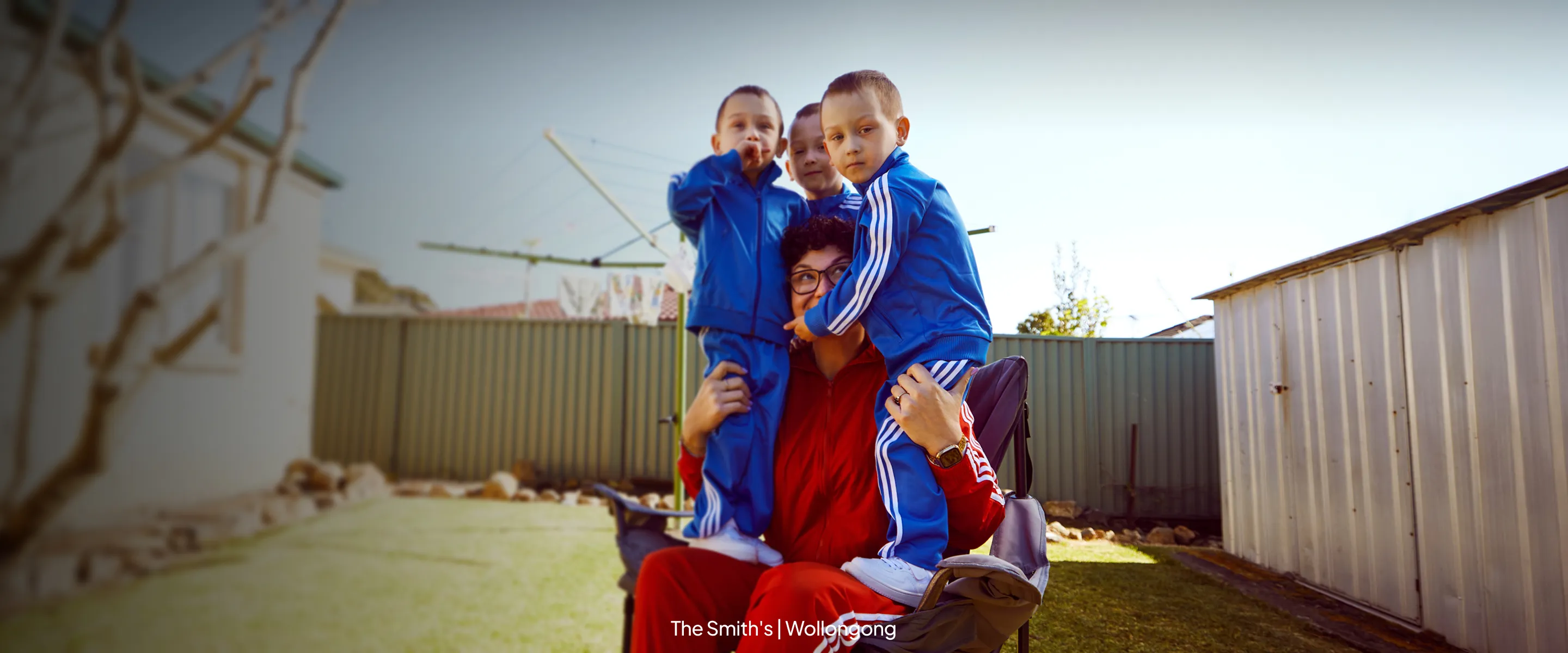 A mum with her 3 boys sitting