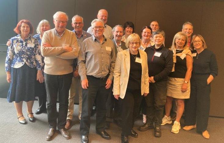 Members engaging in conversation at luncheon