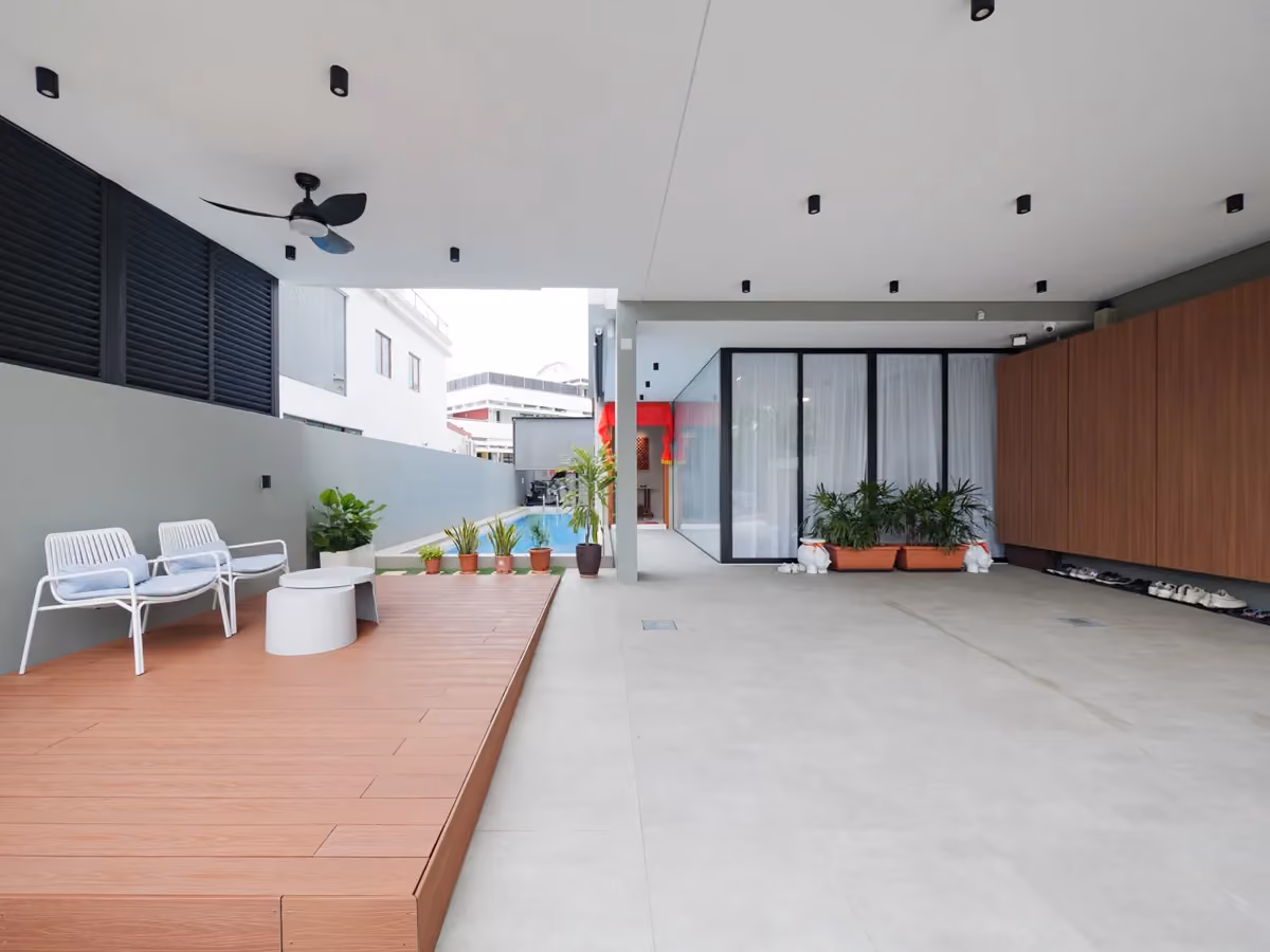 Expansive decking alongside the pool, designed for relaxed gatherings and alfresco living.