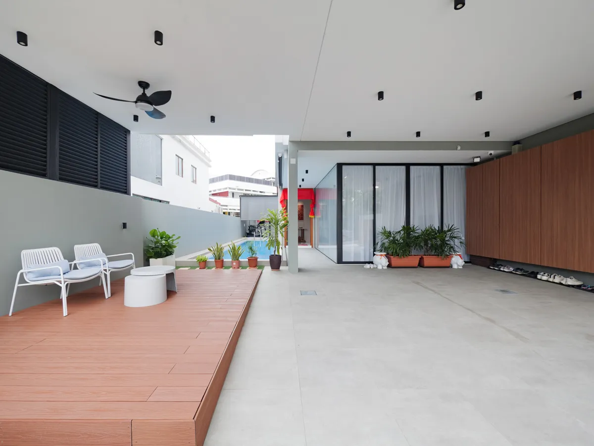 Expansive decking alongside the pool, designed for relaxed gatherings and alfresco living.
