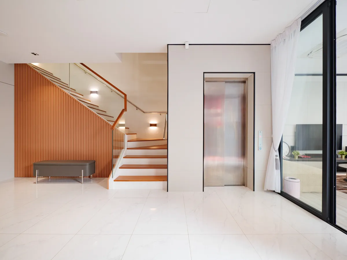 Level 1 private foyer featuring a Schindler Private Home Lift
