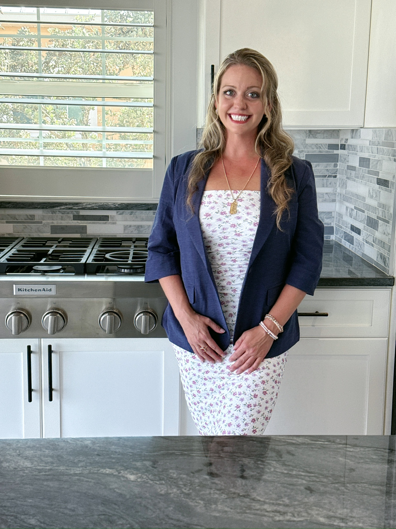Jacee Monsalve, Broker, working with homebuyers in a kitchen. 