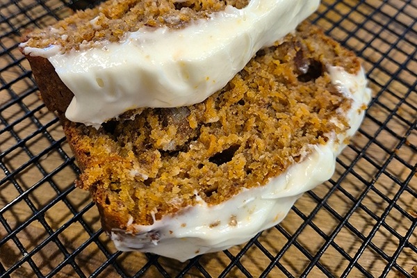 Gluten-free carrot cake with orange and cream cheese frosting