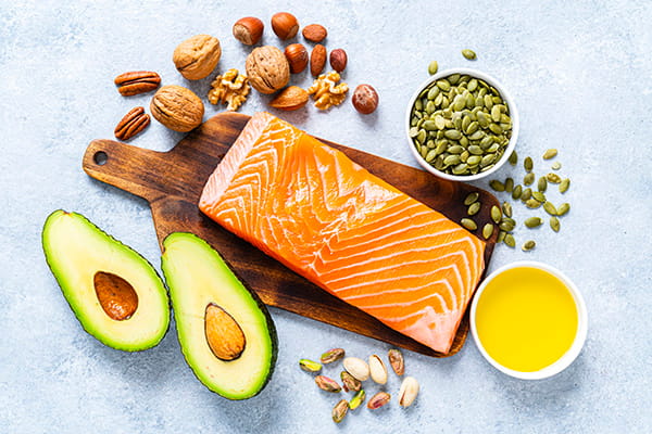 range of food with healthy fats avocado salmon nuts