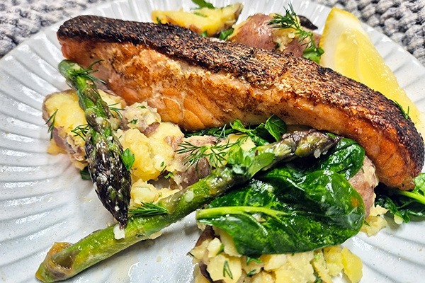 Crispy-skin salmon with herby potato and asparagus salad