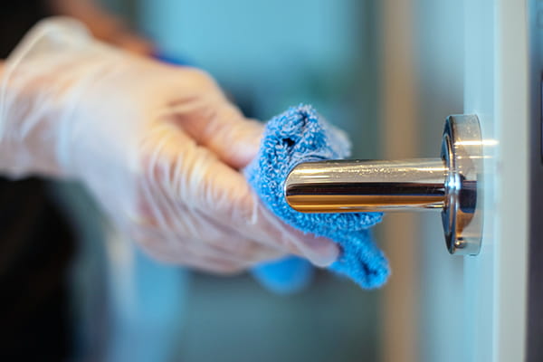 Door handle being cleaned