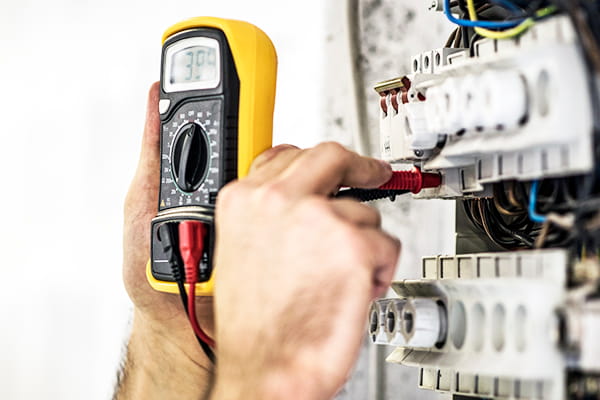 Electrician testing for electrical fault