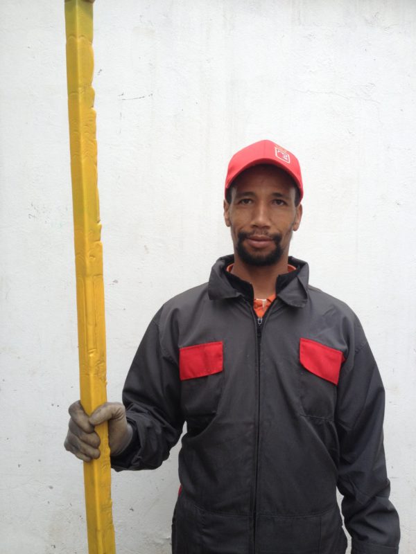 worker holding a beam 