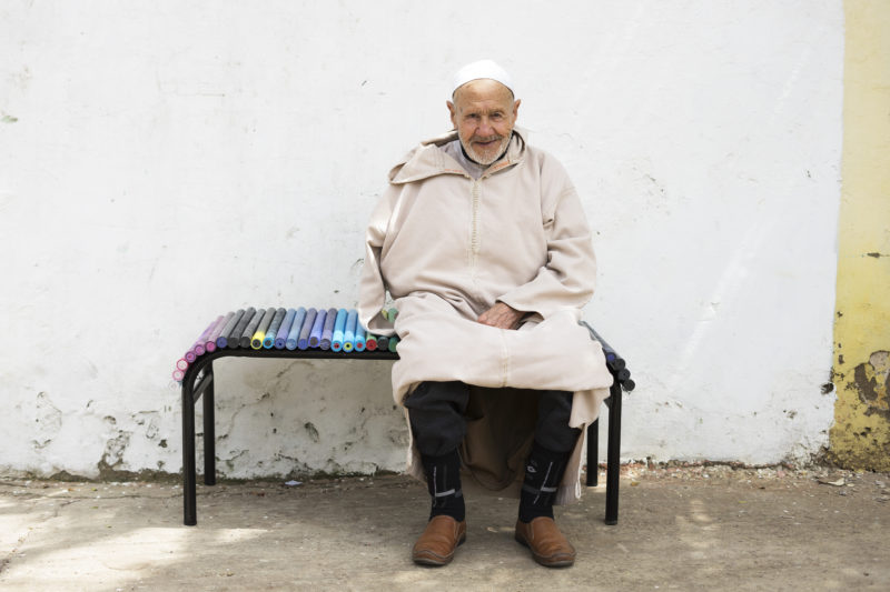 old man sitting on a bench