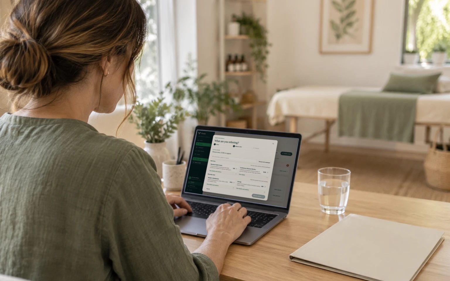 A practitioner using the Vively referral builder on a laptop