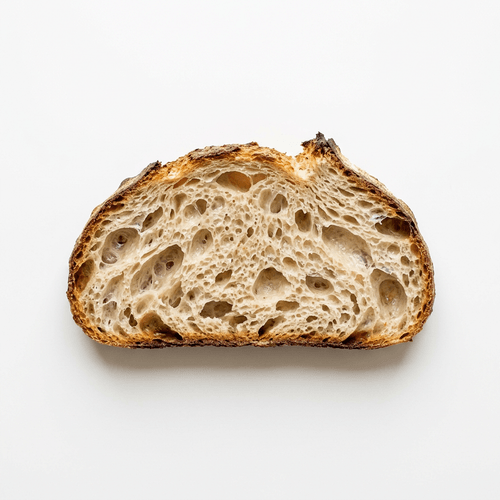 A thick slice of sourdough bread